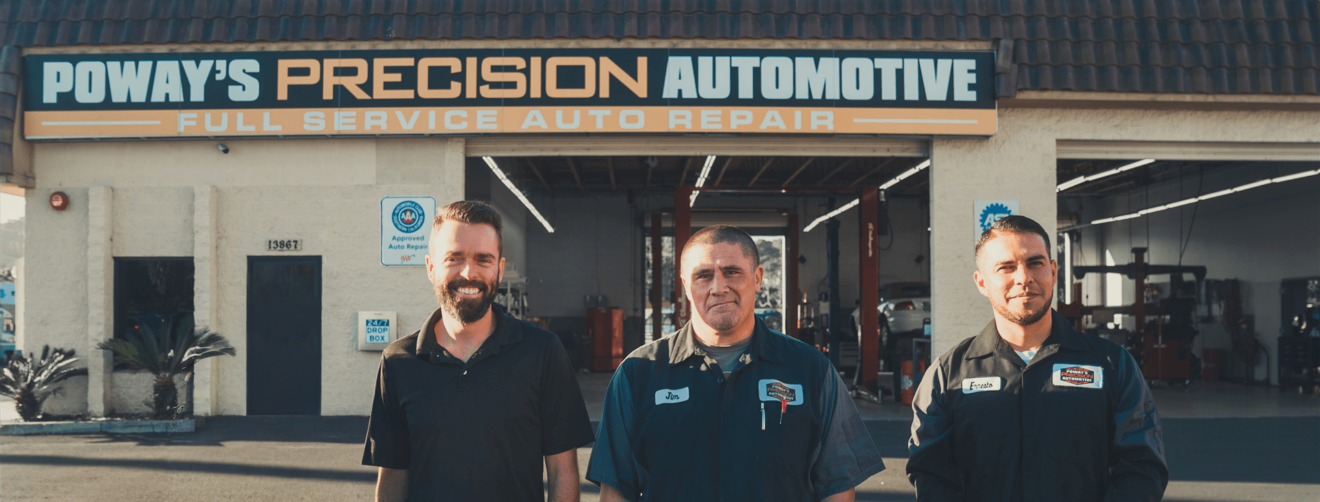 The Precision Automotive team standing in front of their Poway shop